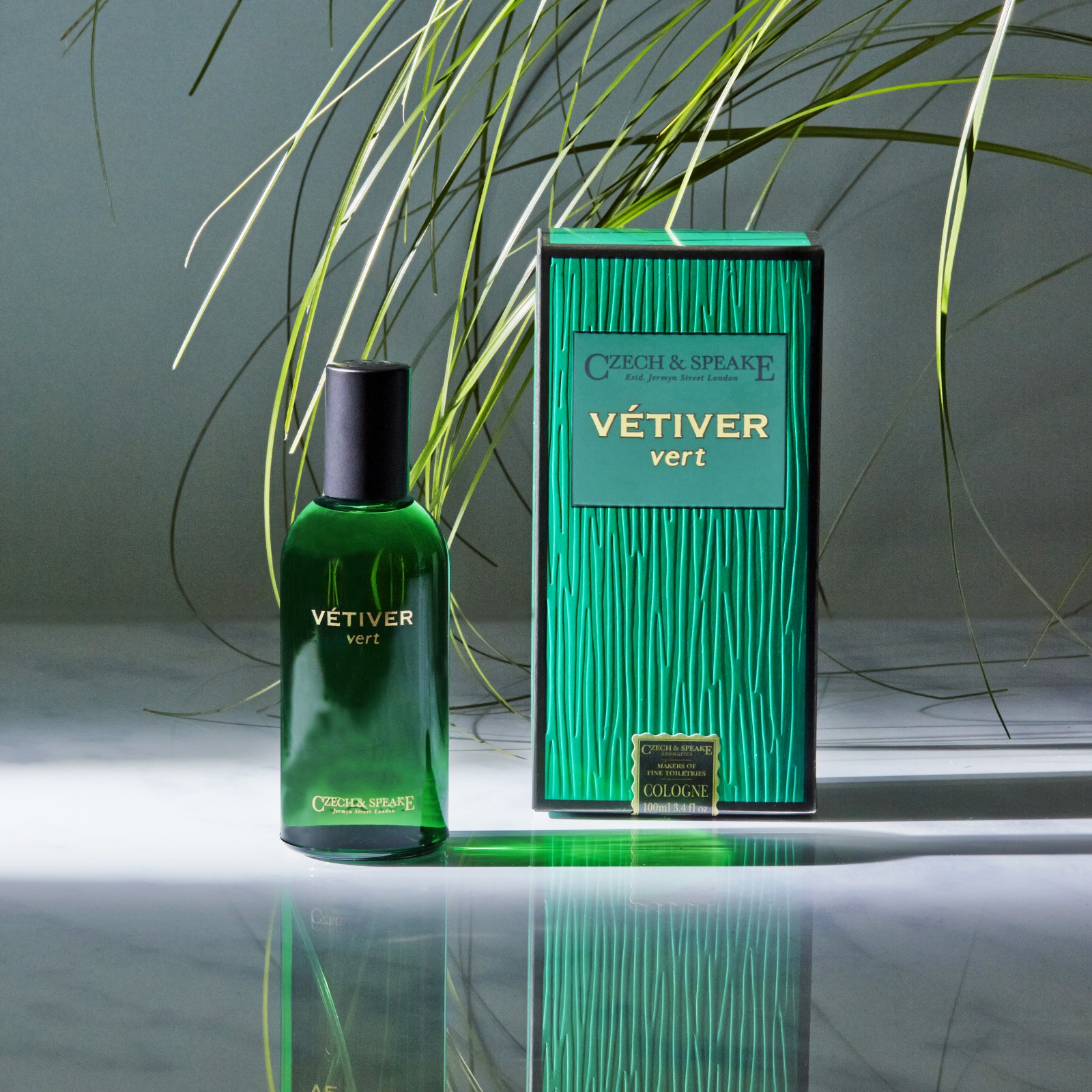 Green bottle of aftershave with green box