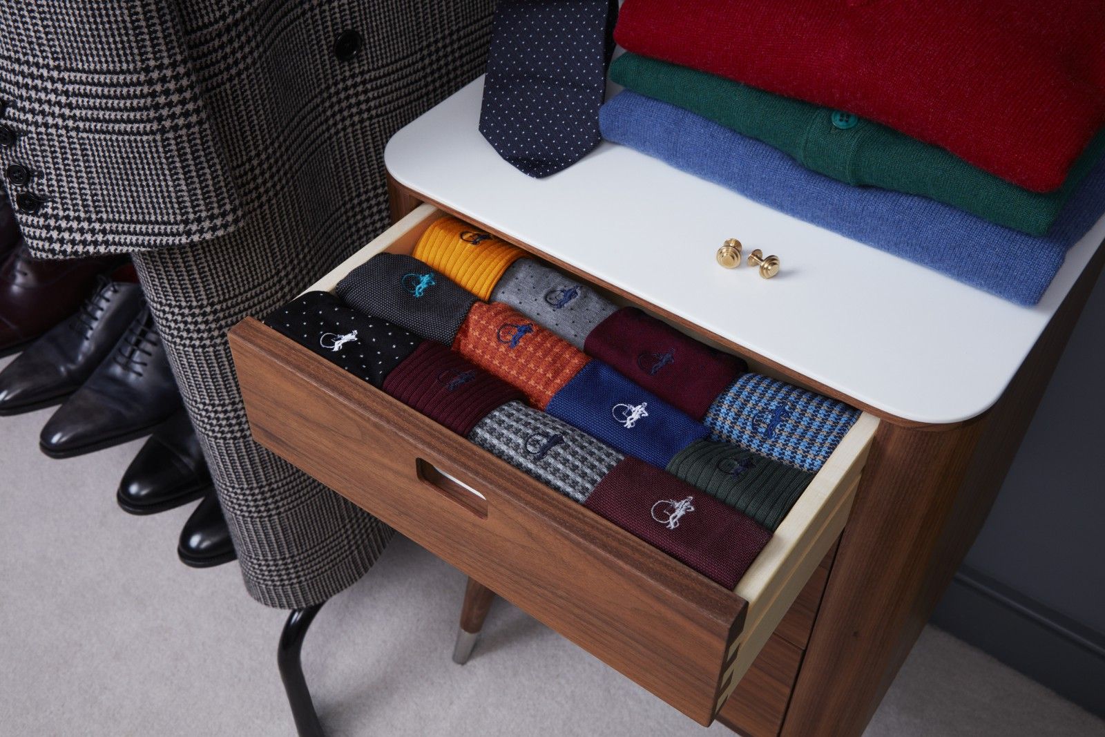 A sock drawer full of different coloured socks