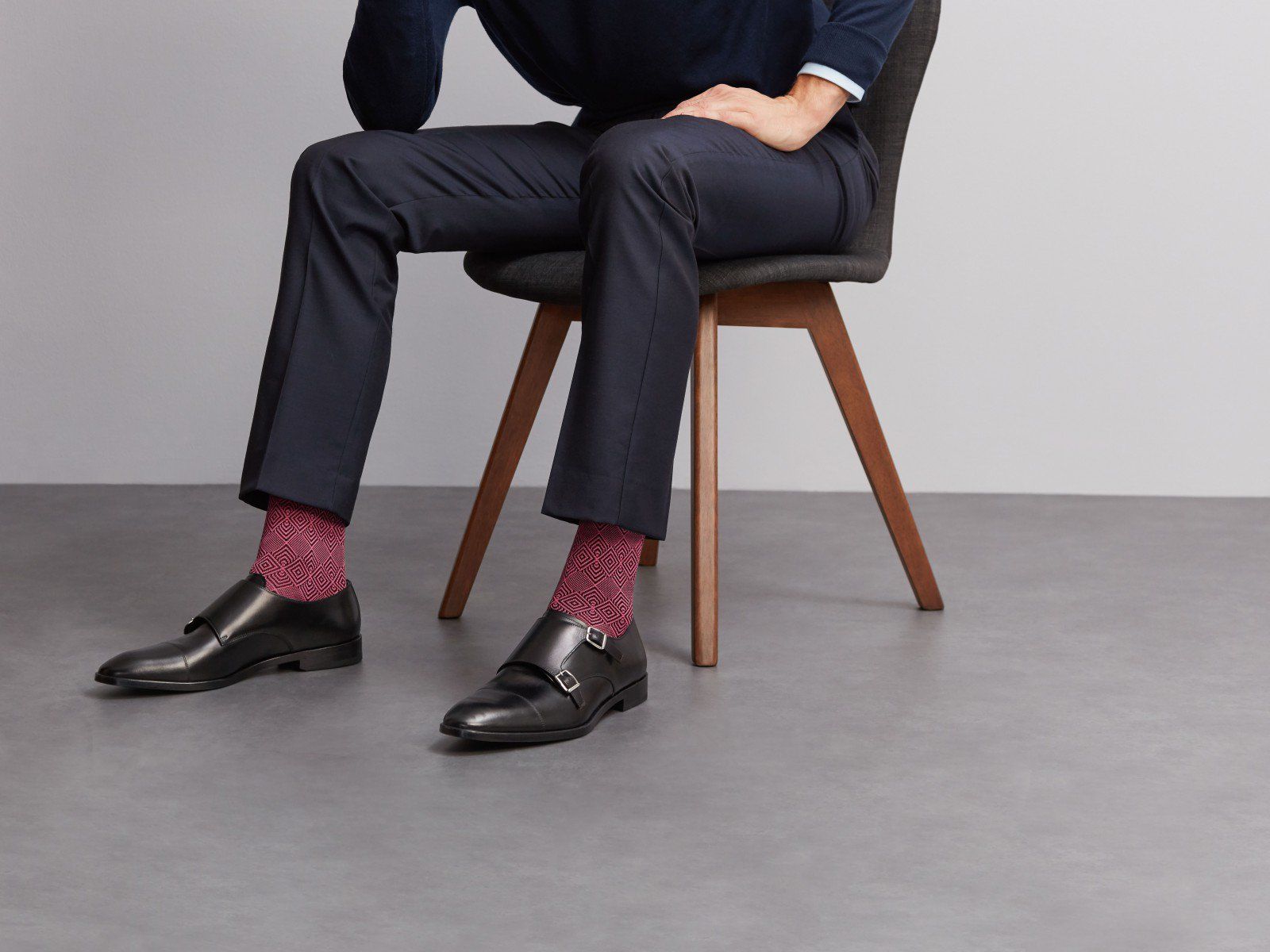 man in suit wearing London Sock Company's jacquard pink socks