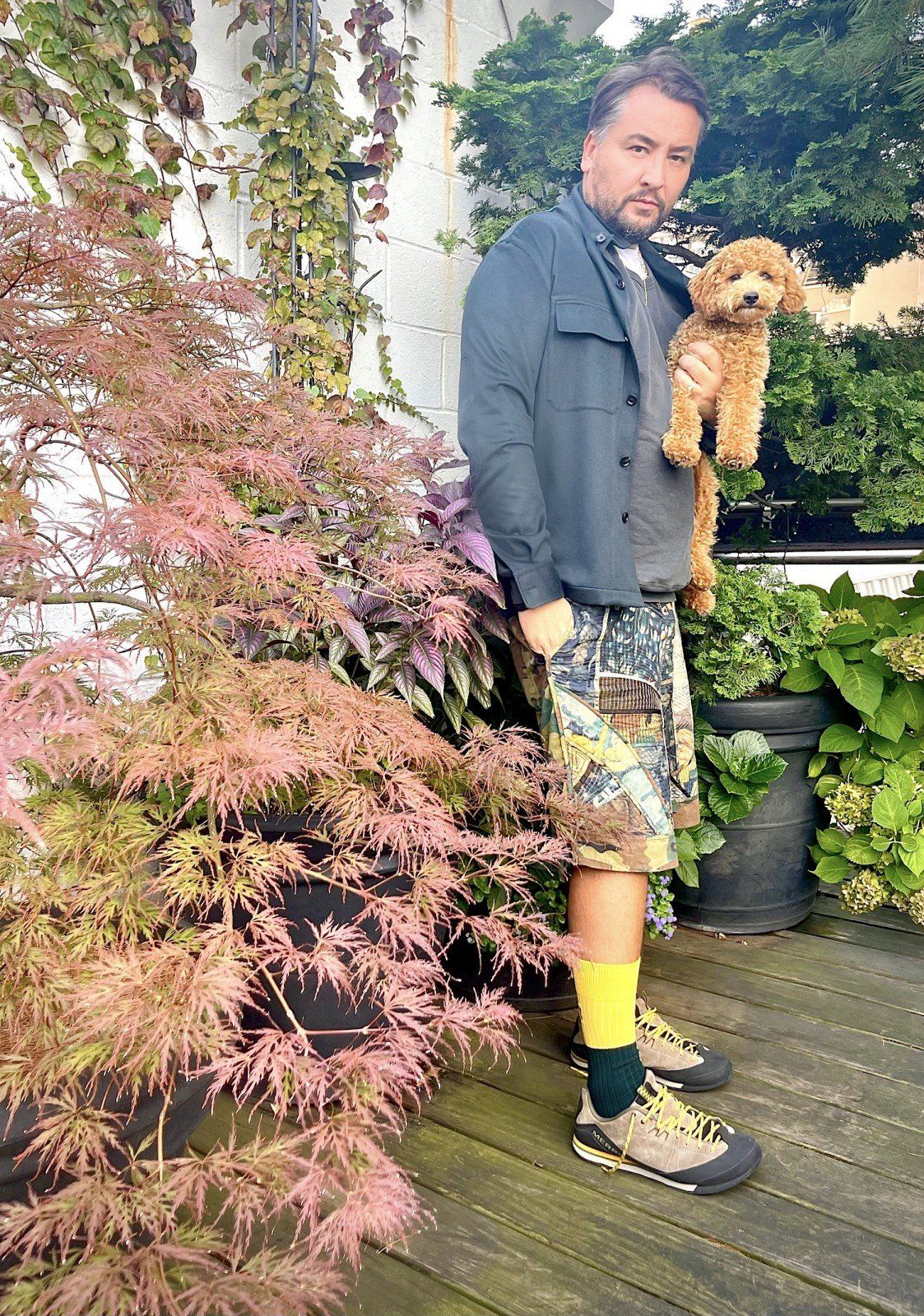 Michael Fisher in Summer Moss socks holding his dog