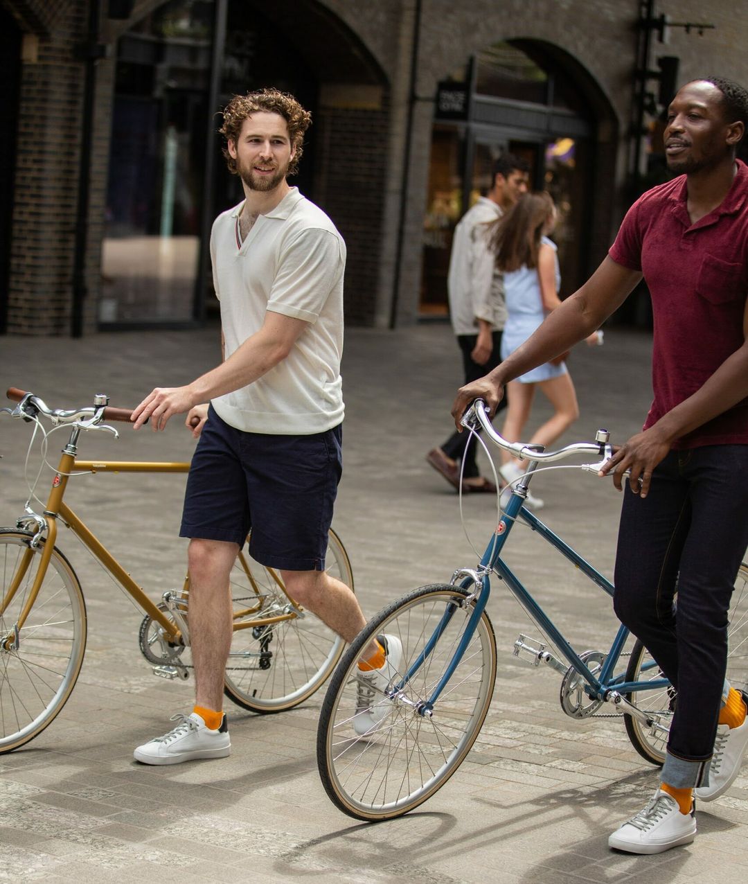 Two men with bicycles