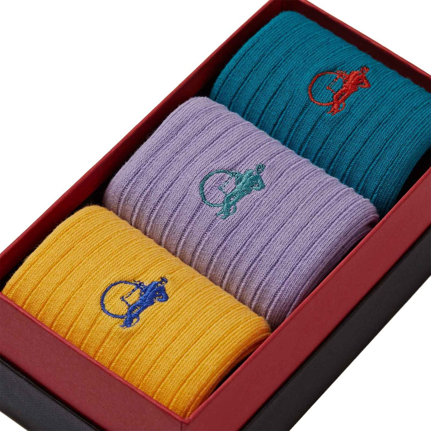 3 pair of blue, lilac and yellow socks in a box