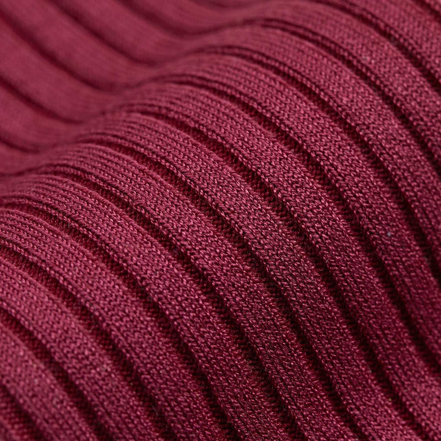A close up of stripes on a red sock