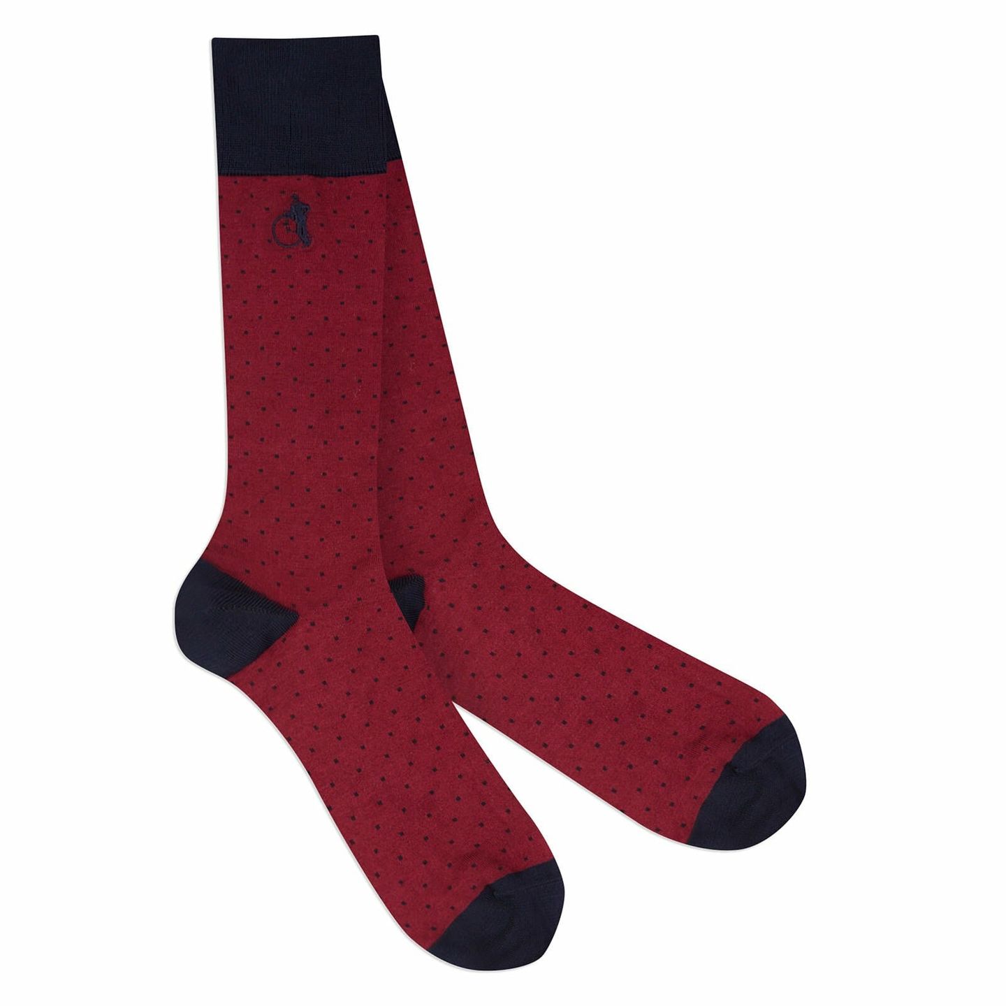 A pair of red socks with patterned black dots