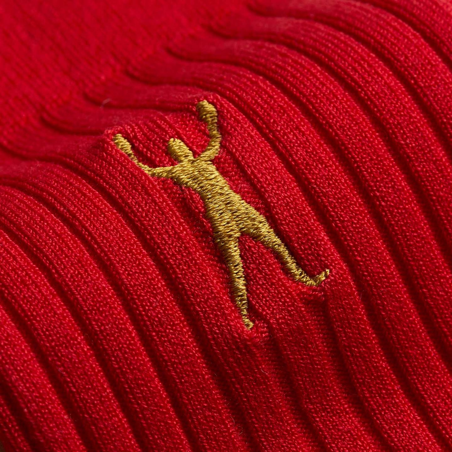Close up of Muhammad Ali red socks and gold logo