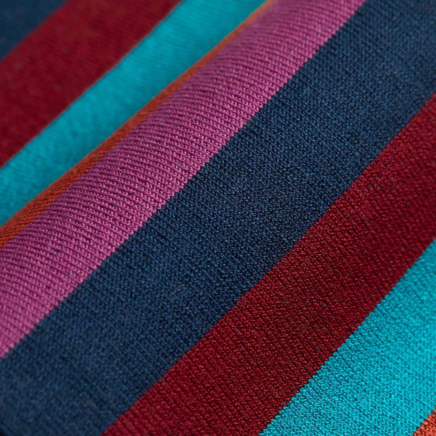 A close up of a sock with lots of stripes filled with different colours