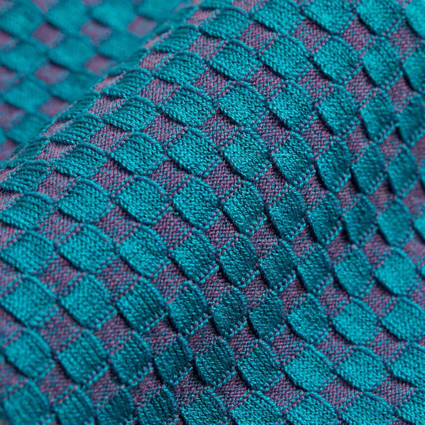 Close up of blue patterned socks mixed with purple