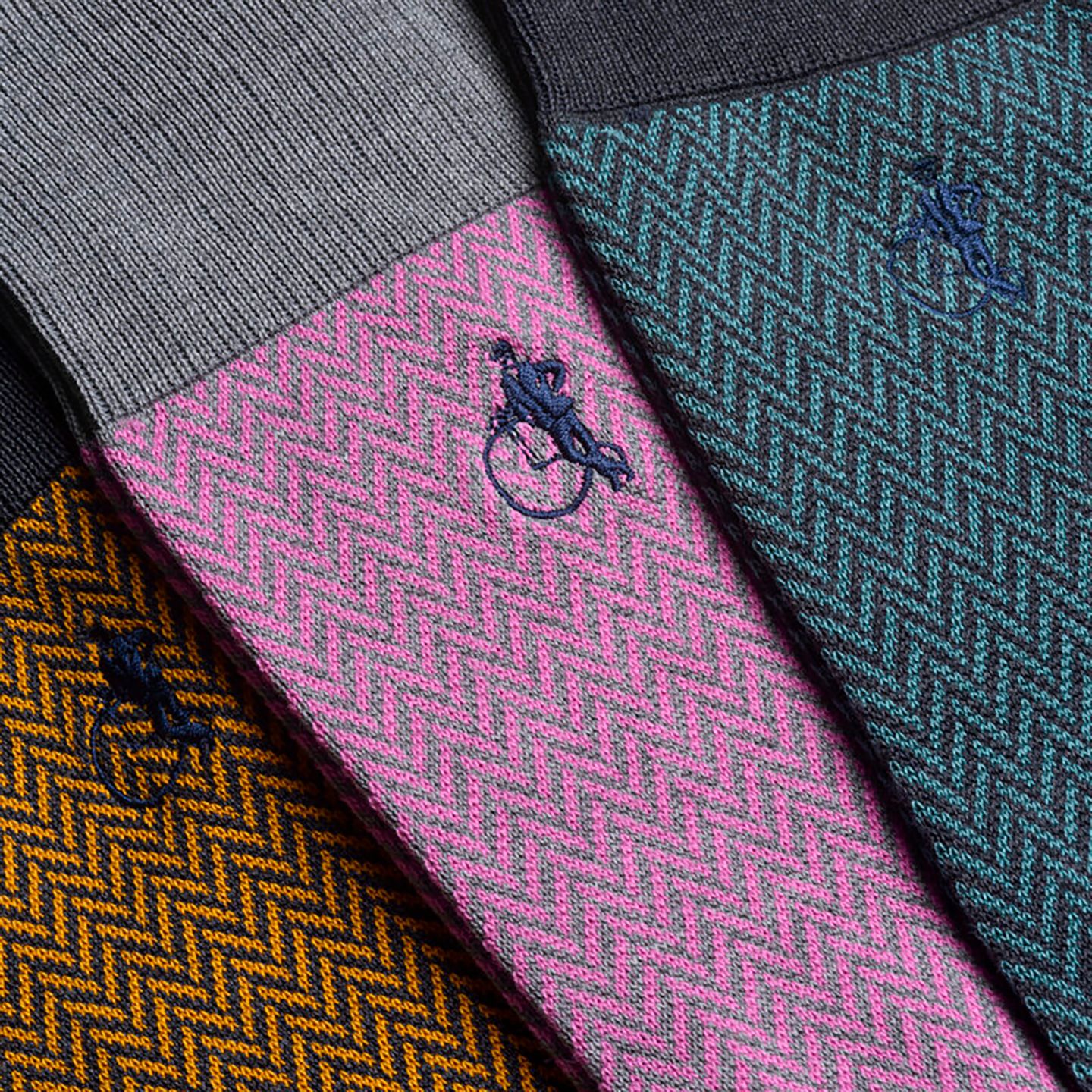 Close up of the Herringbone collection featuring a pink and grey combo