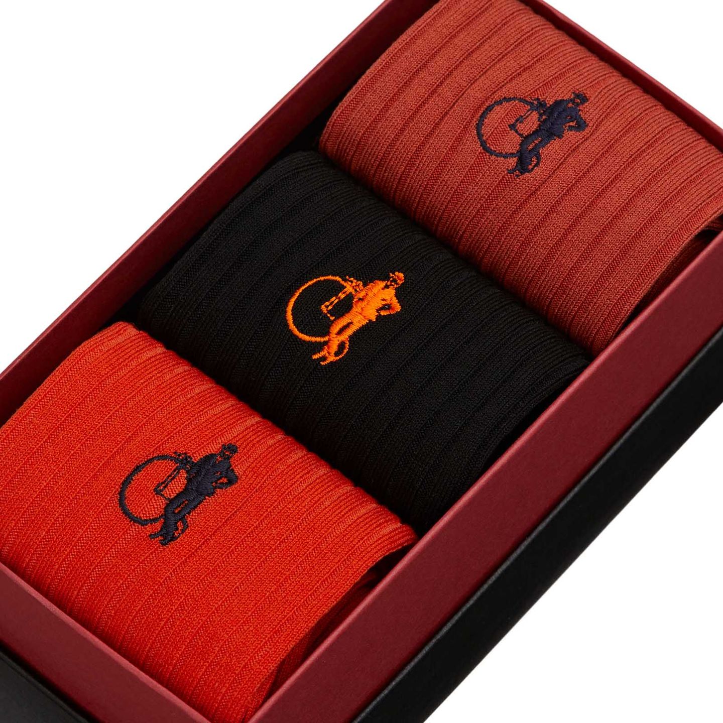 Rust collection in a presentation box, with dark orange, black and vibrant orange socks