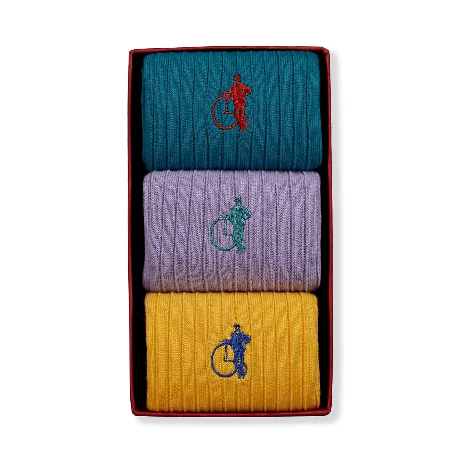 3 Pair Box with a dark teal, lilac and yellow coloured socks, all with the LSC logo