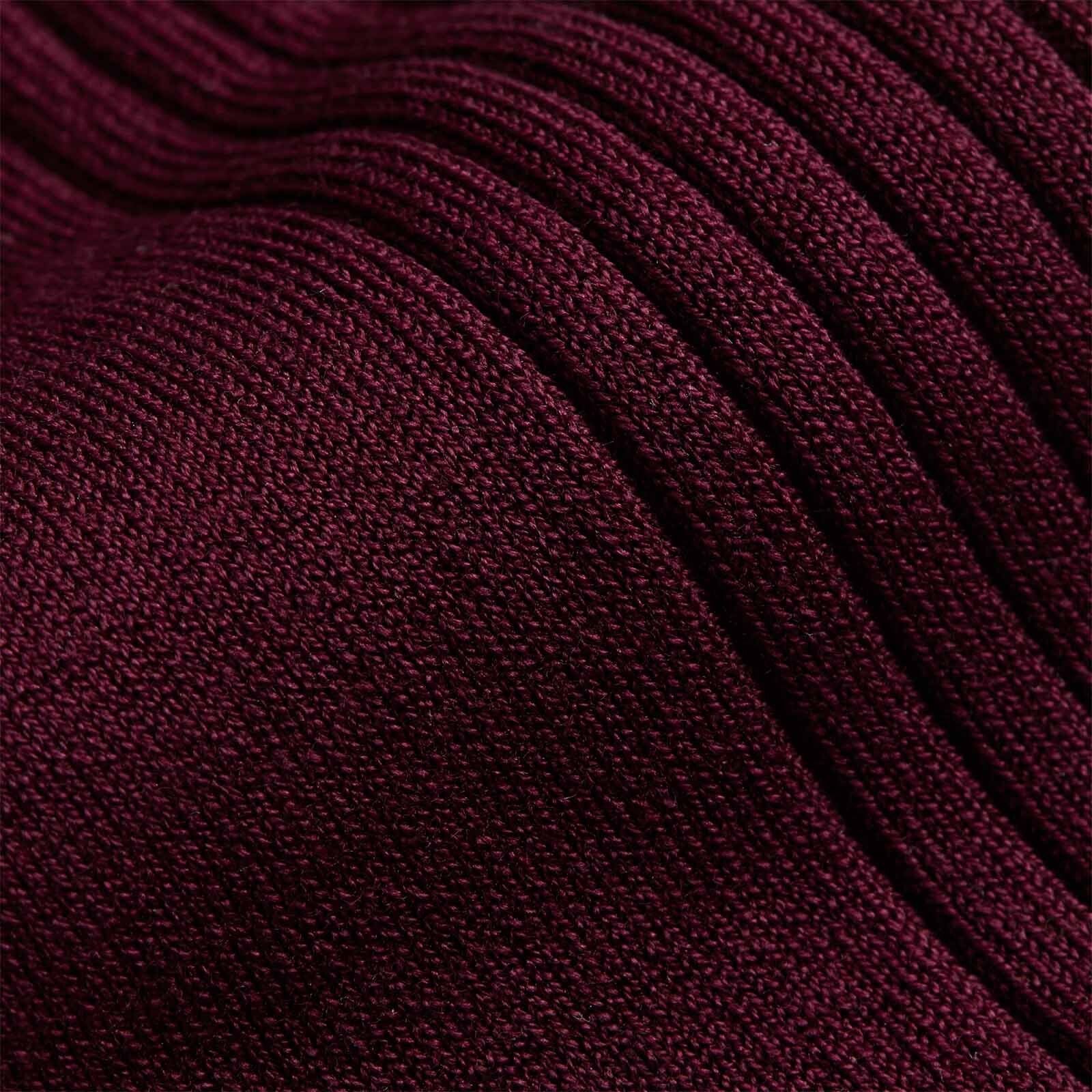 Close up of knee high burgundy socks