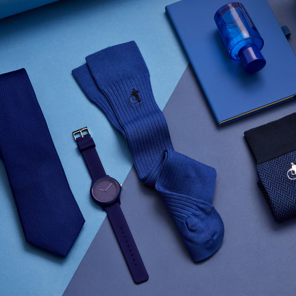 Collection of blue themed products, including a watch, tie and LSC dark blue socks