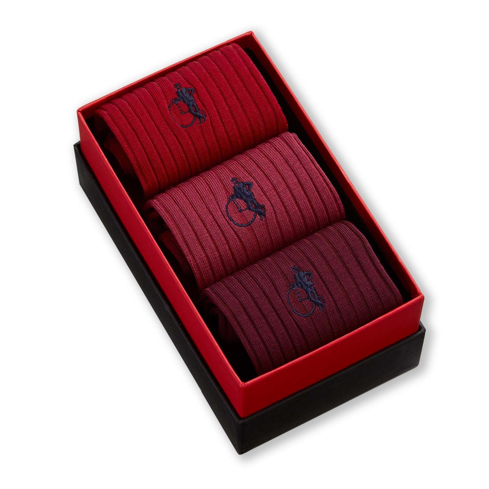 Trio of different red hue socks in a presentation box