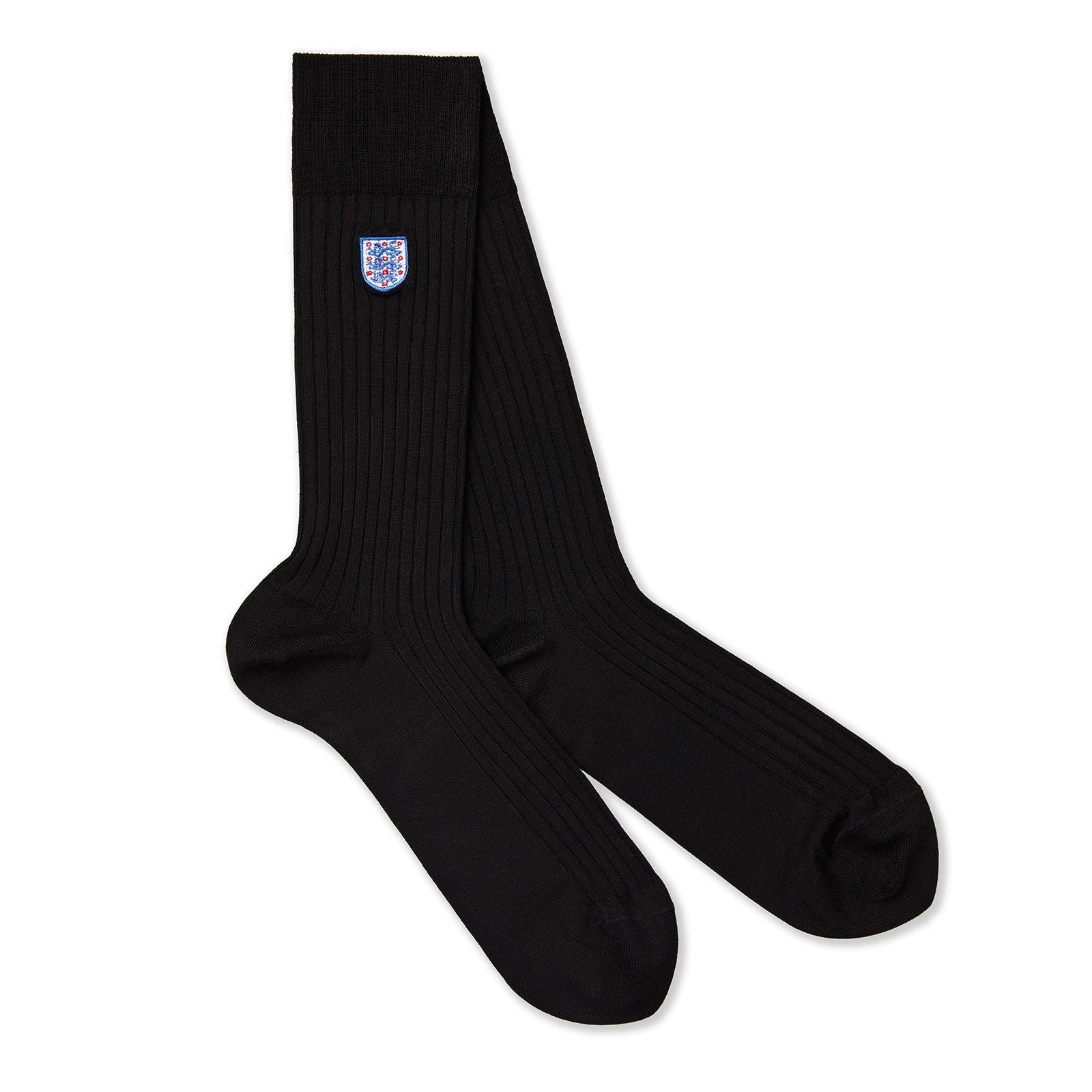 A pair of black socks with the England badge on them