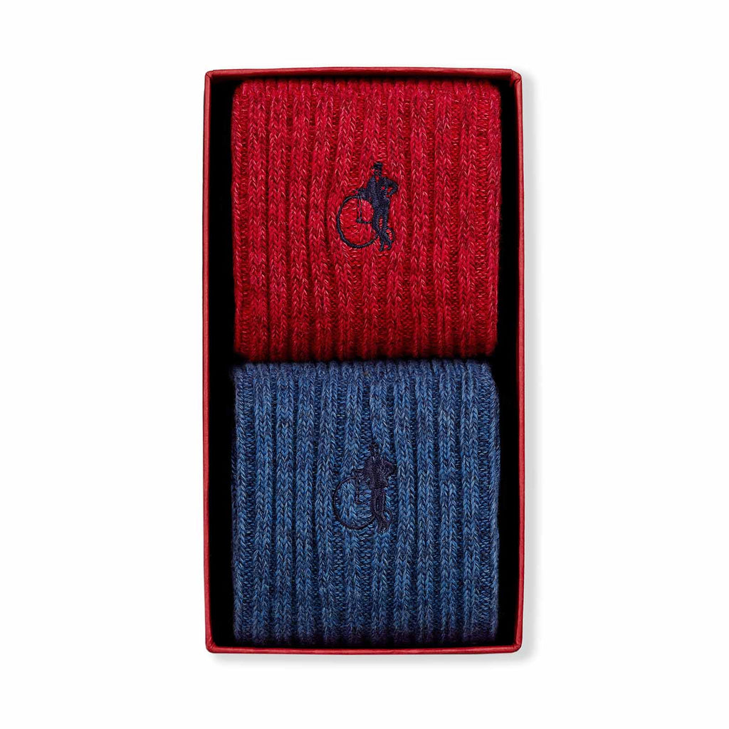 A pair of knitted socks shown flat.